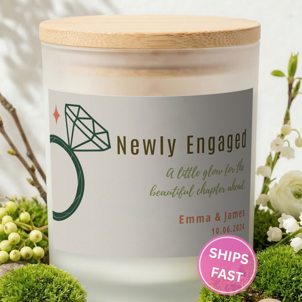 A Little Glow for the Chapter Ahead personalized frosted candle with bamboo lid in a lifestyle scene with greenery