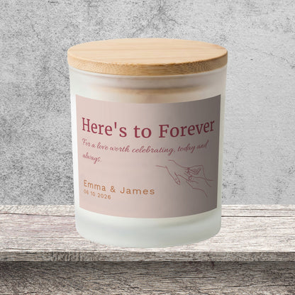DESIGN A - Here's to Forever personalized frosted candle on a stone backdrop