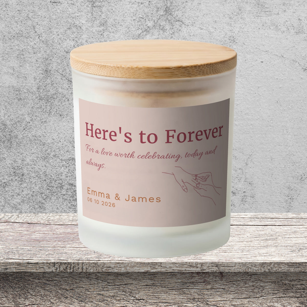 DESIGN A - Here's to Forever personalized frosted candle on a stone backdrop
