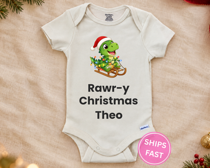 Rawr-y Christmas T-rex personalized baby bodysuit laid flat on a soft blanket
