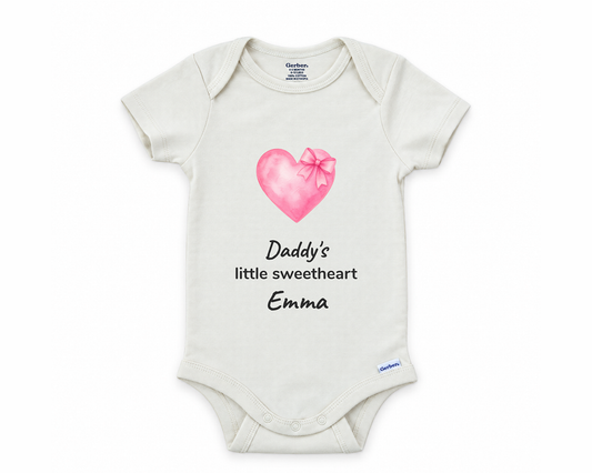Daddy's Little Sweetheart personalized baby bodysuit with pink watercolor heart and bow on a white background