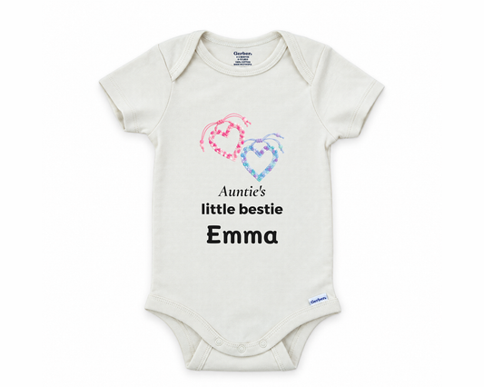 Auntie's Little Bestie personalized baby bodysuit with beaded friendship hearts on a white background