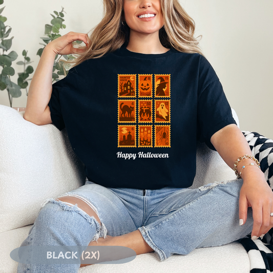Woman wearing a black Halloween postage stamp t-shirt with spooky designs and the text 'Happy Halloween'.