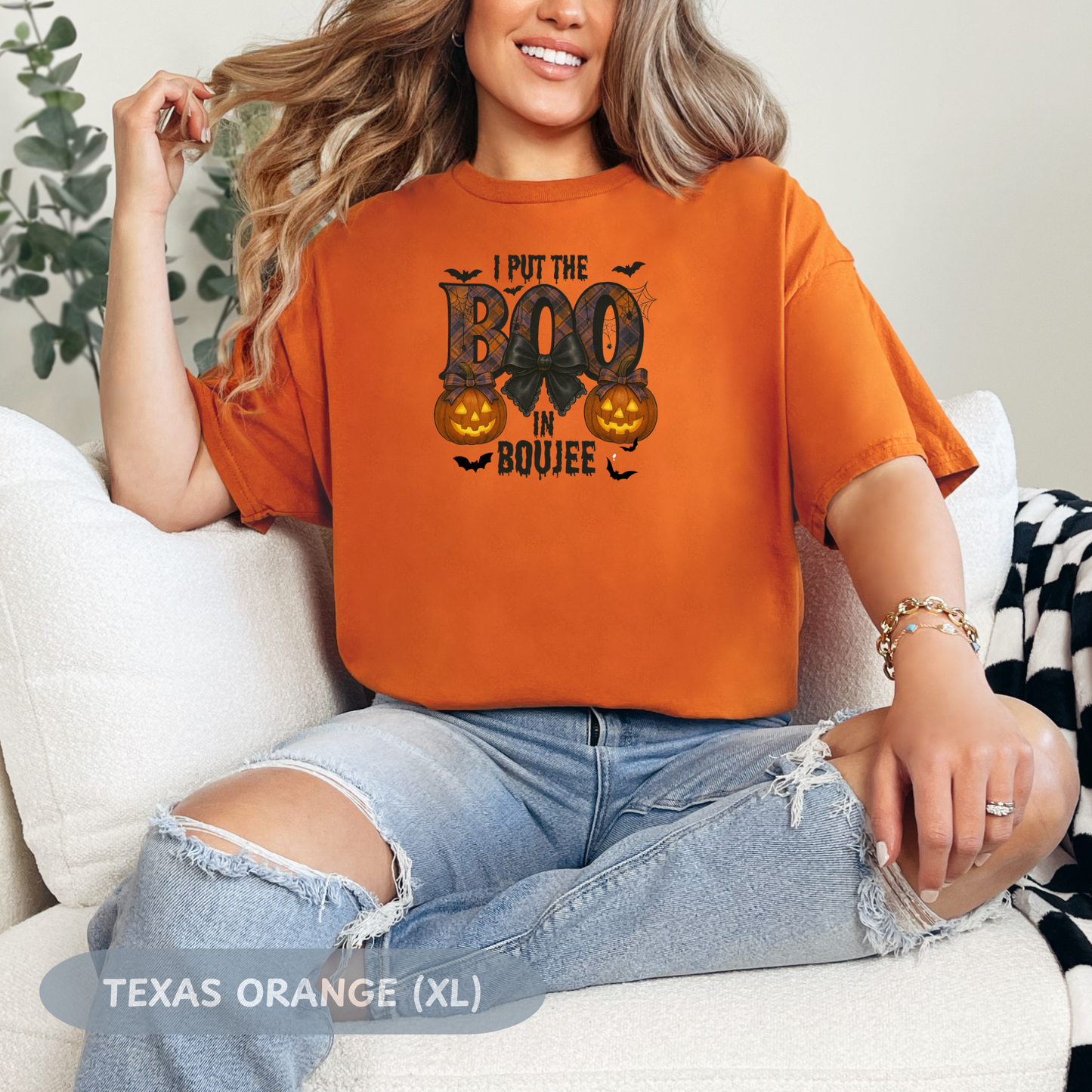 Model wearing the 'Boo in Boujee' Halloween shirt in Texas Orange, showcasing a spooky graphic design and relaxed fit.