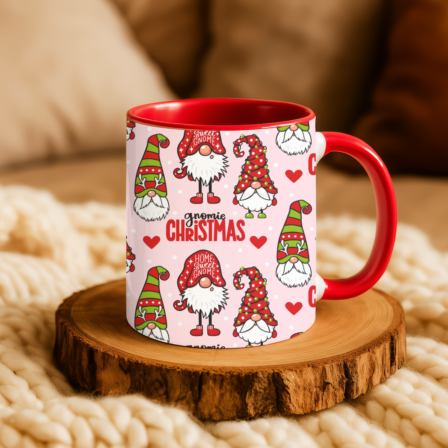 Festive Christmas gnome coffee mug with red handle on a wooden coaster, surrounded by cozy knit decor.