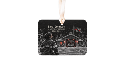 thin red line firefighter ornament with a snowy fire station night scene on a white background